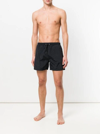 Shop Mcq By Alexander Mcqueen Swallow Badge Swim Trunks In Black