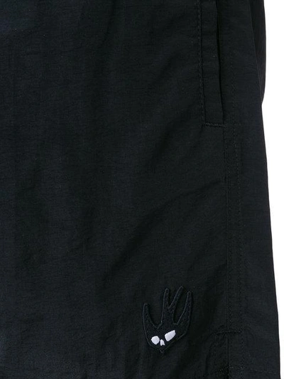 Shop Mcq By Alexander Mcqueen Swallow Badge Swim Trunks In Black