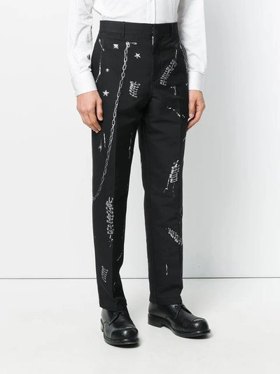 Shop Alexander Mcqueen Safety Pin Print Trousers In Black