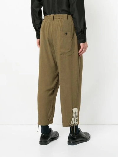 Shop Yohji Yamamoto Loose Fit Cropped Trousers In Green