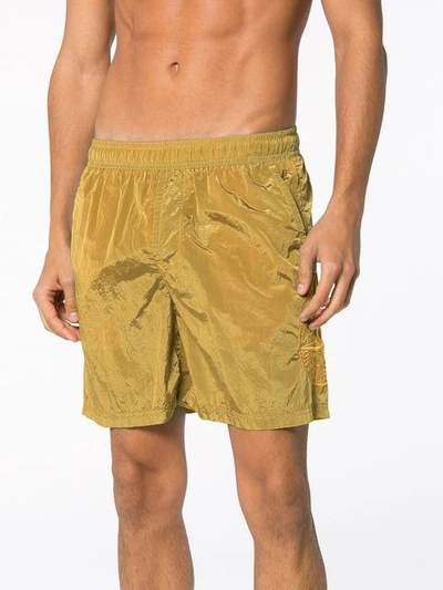 Shop Stone Island Metal Garment Dyed Swim Shorts - Yellow & Orange