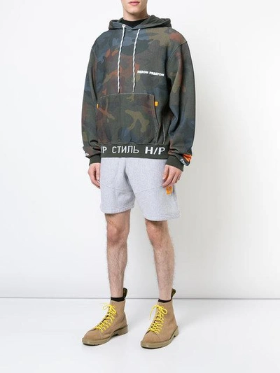 Shop Heron Preston Printed Camouflage Hoodie - Multicolour