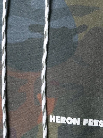 Shop Heron Preston Printed Camouflage Hoodie - Multicolour