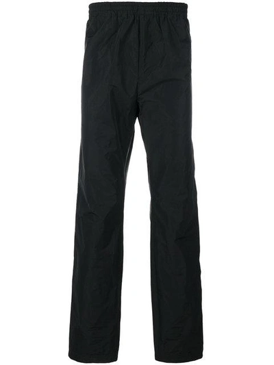 Shop White Mountaineering Wide Leg Track Pants In Black