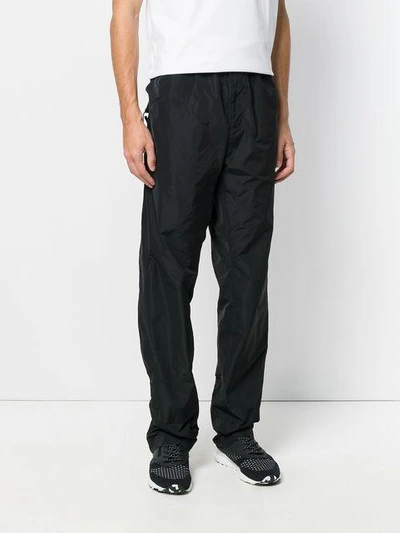 Shop White Mountaineering Wide Leg Track Pants In Black