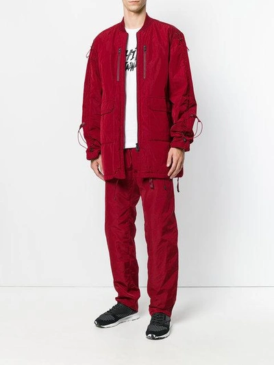 Shop White Mountaineering Wide Leg Track Pants In Red