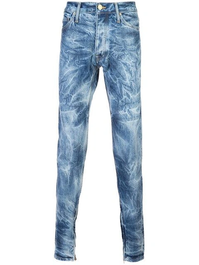 Shop Fear Of God Bleached Effect Slim In Indigo Holy Water