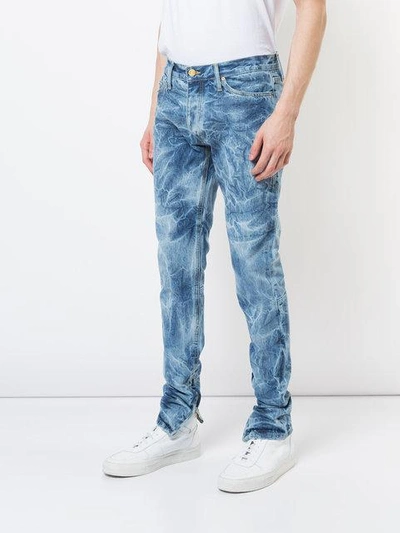 Shop Fear Of God Bleached Effect Slim In Indigo Holy Water