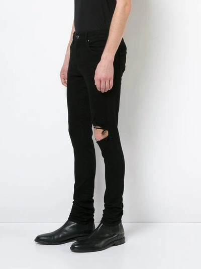 Shop Amiri Broken Jeans In Black