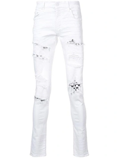 Shop Amiri Art Patch Skinny Jeans - White