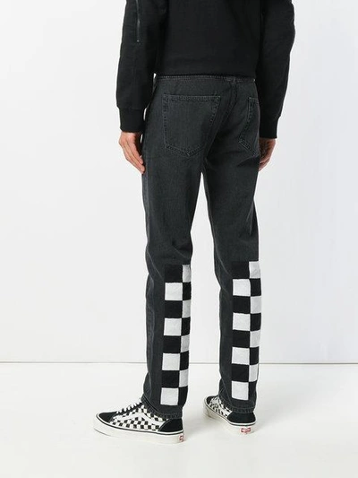 Shop Off-white Checkered Detail Jeans