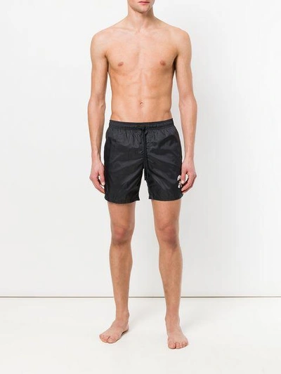 Shop Fendi Karlito-appliqué Swim Shorts - Black