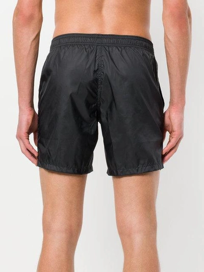 Shop Fendi Karlito-appliqué Swim Shorts - Black