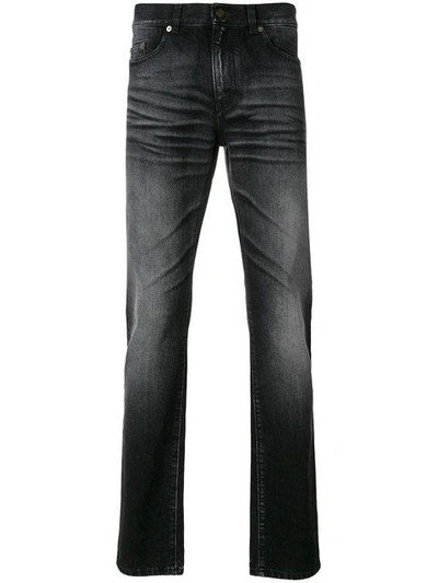 Shop Saint Laurent Faded Slim-fit Jeans In Black