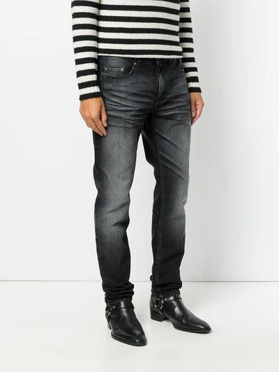Shop Saint Laurent Faded Slim-fit Jeans In Black