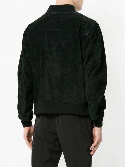 Undercover Zip Pocket Bomber Jacket In Black