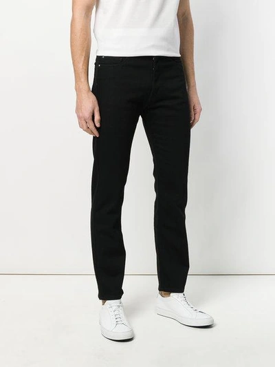 Shop Versace Slim Fit Jeans In Black