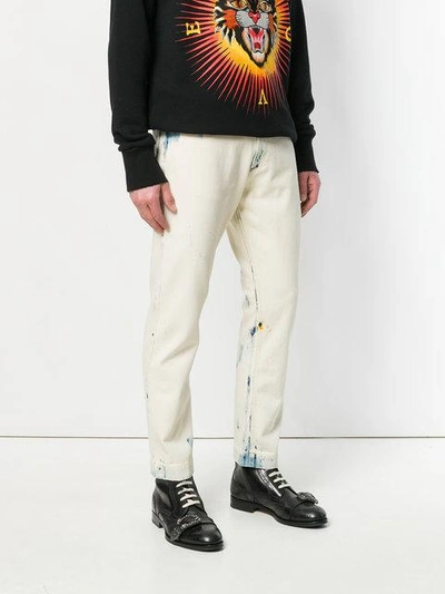 Shop Gucci Bleached-effect Jeans In White