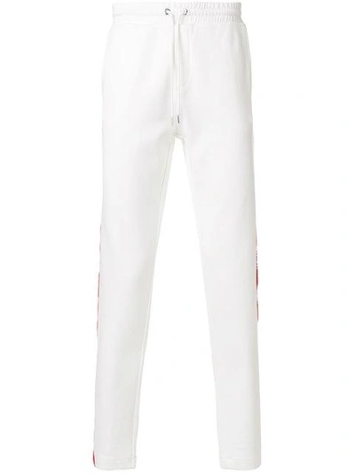 Shop Moncler Logo Stripe Track Pants - White