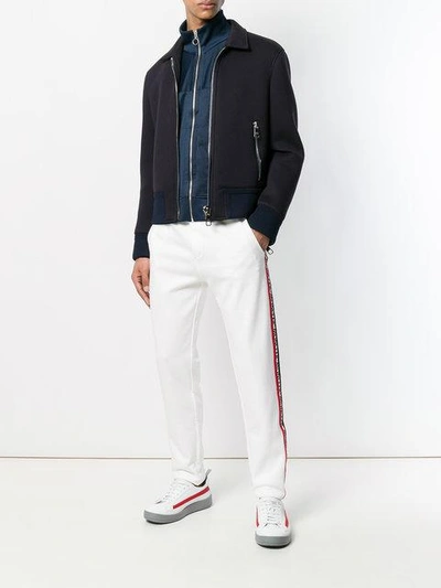 Shop Moncler Logo Stripe Track Pants - White