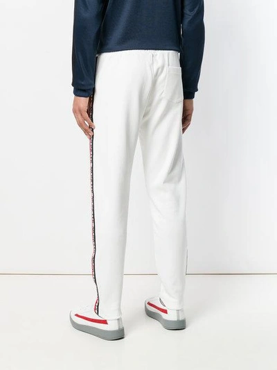 Shop Moncler Logo Stripe Track Pants - White