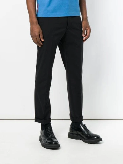 Shop Prada Slim-fit Trousers - Black
