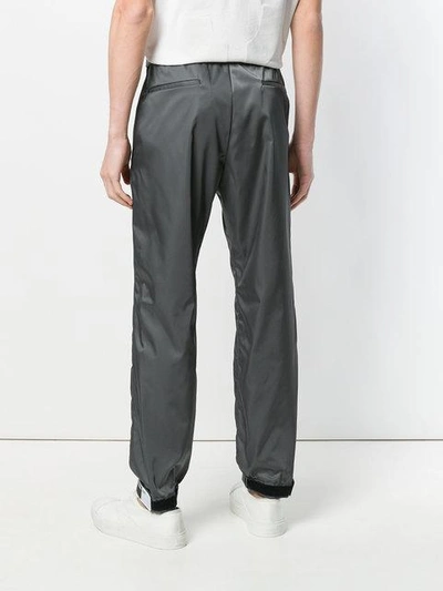 Shop Prada Rubber Tag Track Pants In Grey