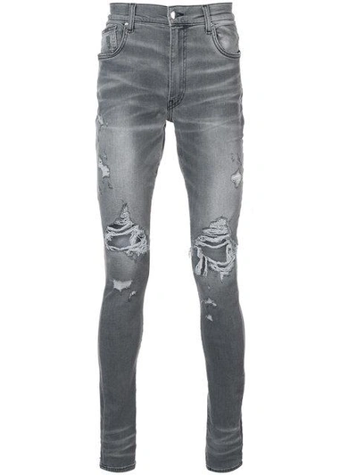 Shop Amiri Thrasher Jeans - Grey