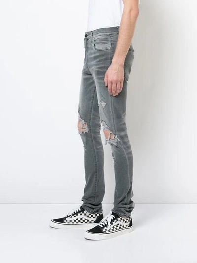 Shop Amiri Thrasher Jeans - Grey