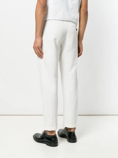 Shop Ann Demeulemeester Straight-leg Trousers - White