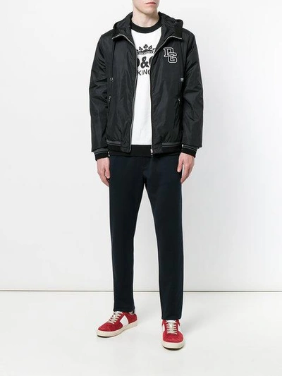 Shop Dolce & Gabbana Hooded Bomber Jacket With Logo Patch - Black