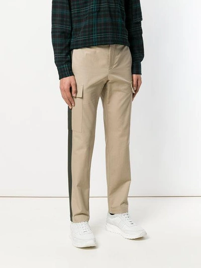 Shop Msgm Side Stripe Trousers In Neutrals