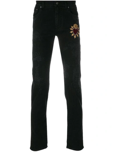 Shop Dolce & Gabbana Heart Appliqué Jeans In Black