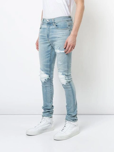 Shop Amiri Mx1 Leather Patch Jeans In Blue