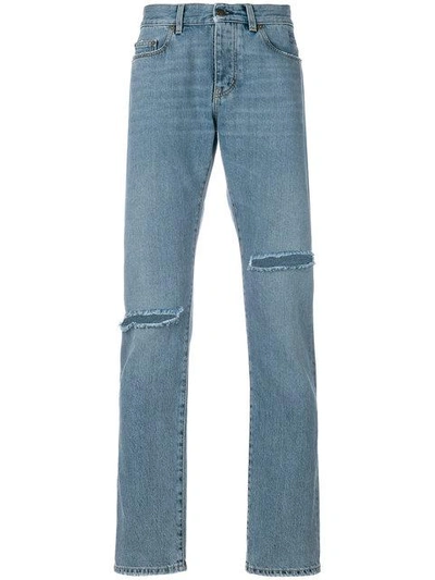 Shop Saint Laurent Distressed Low-rise Jeans In Blue