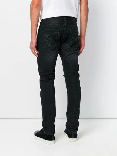 Shop Philipp Plein Distressed Straight-leg Jeans - Black