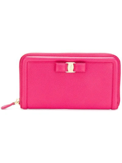 Shop Ferragamo Zip Around Bow Wallet In Pink