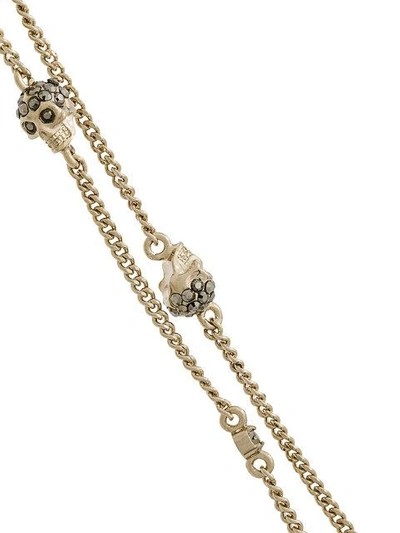 Shop Alexander Mcqueen Multi Chain Skull Charm Bracelet In Metallic