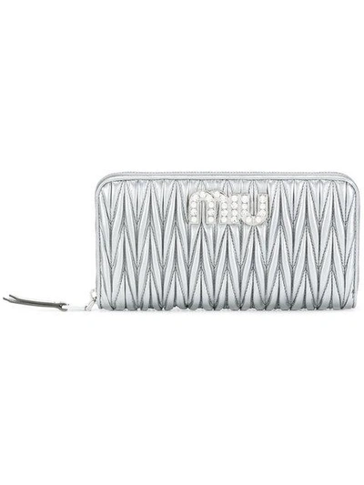 Shop Miu Miu Quilted Zipped Wallet - Farfetch In Metallic