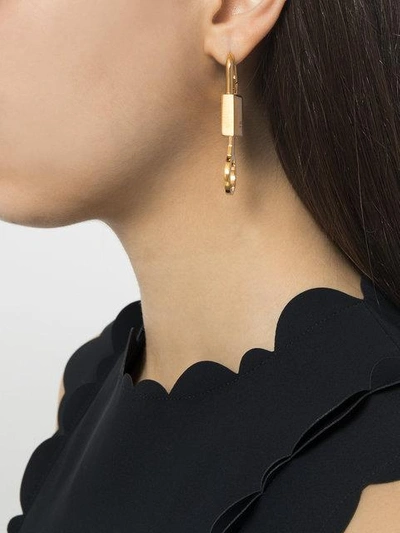 Shop Ambush Padlock Earring In Metallic