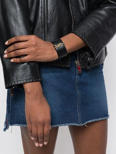 Shop Saint Laurent Monogram Cuff Bracelet - Black