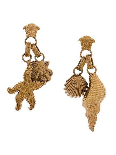 Shop Versace Seashell Medusa Earrings - Metallic
