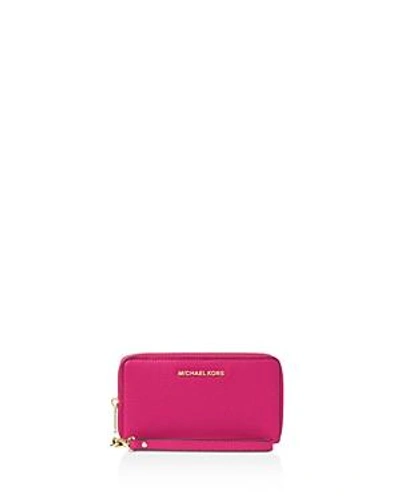 Shop Michael Michael Kors Flat Multi-function Large Leather Smartphone Wristlet In Ultra Pink/silver