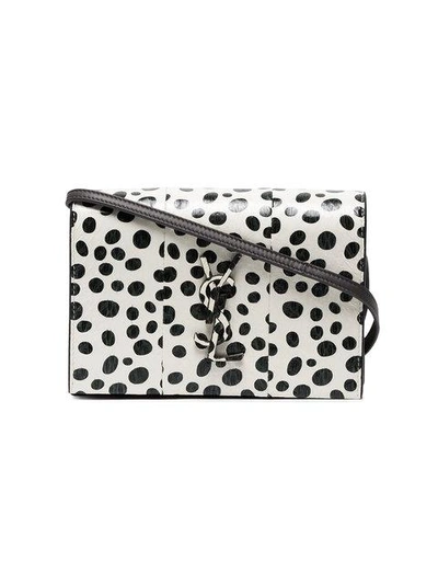 Kate polka dot leather wallet on a chain