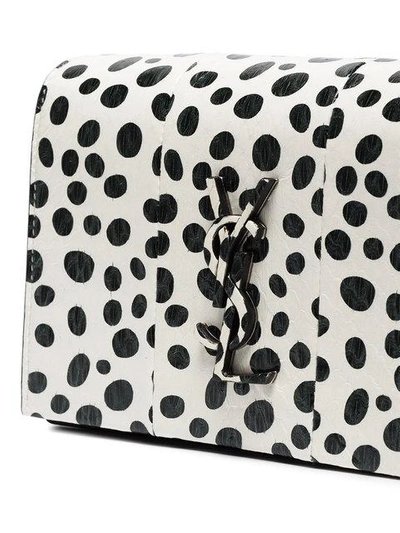 Kate polka dot leather wallet on a chain