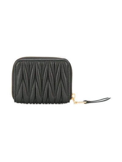 Shop Miu Miu Lettering Logo Zipped Purse In Black