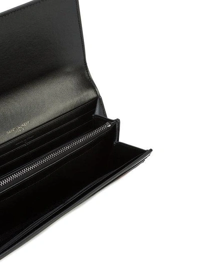 Shop Saint Laurent Rose Print Foldover Wallet In Black