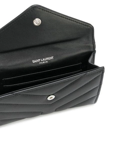 Shop Saint Laurent Quilted Logo Purse In Black