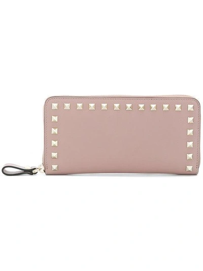 Shop Valentino Rockstud Zip-around Wallet In Pink