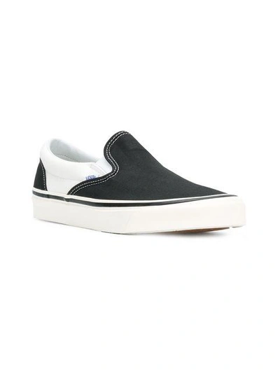 Shop Vans Classic Slip-on Trainers In Black